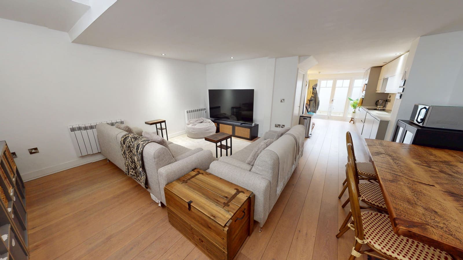 High-spec renovated living room with oak flooring and bespoke storage, Borough Street Brighton
