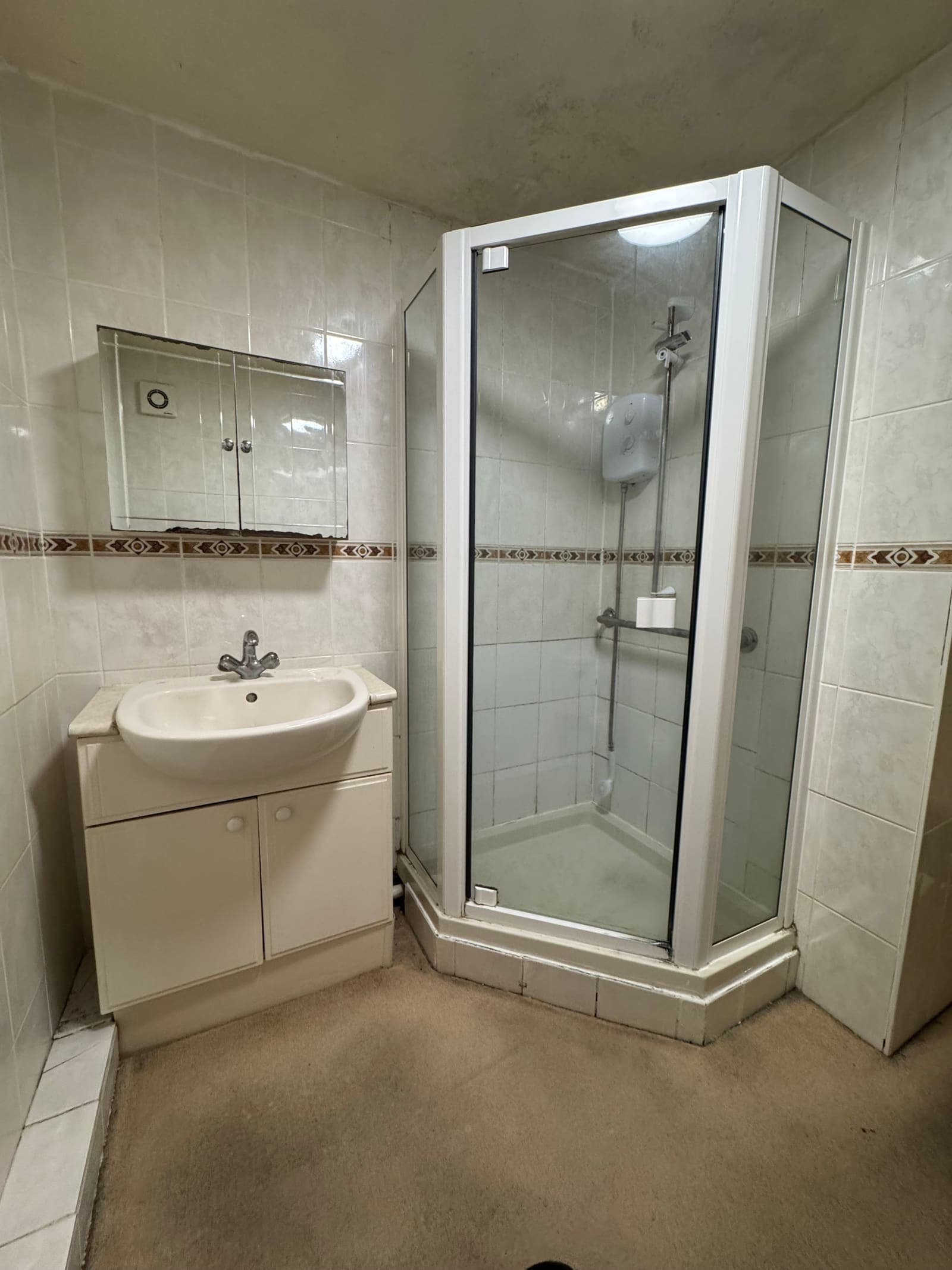 Old bathroom with dated corner shower and pedestal basin before renovation, Heather Court