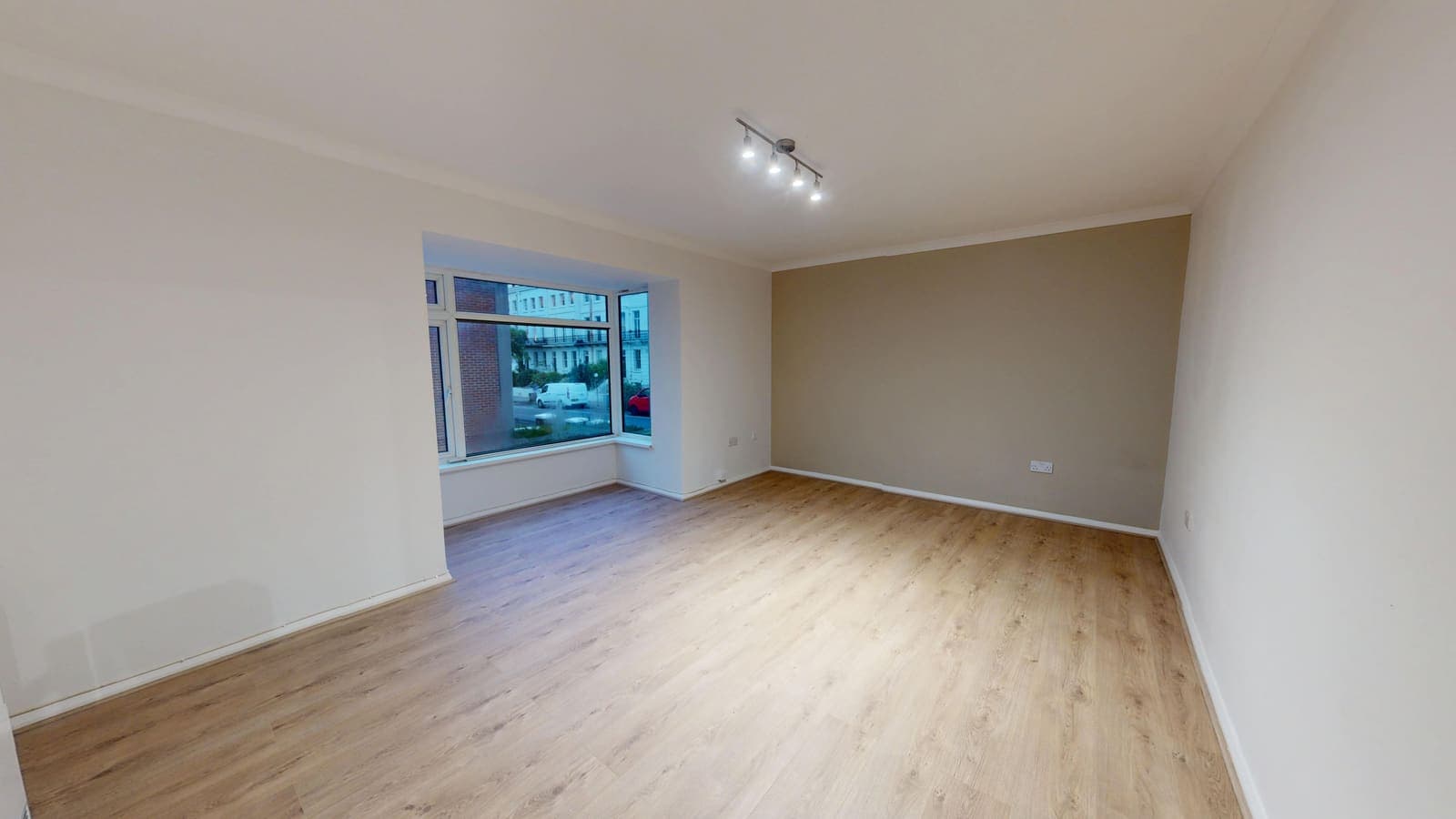 Renovated living space with new wood-effect flooring, Heather Court Brighton