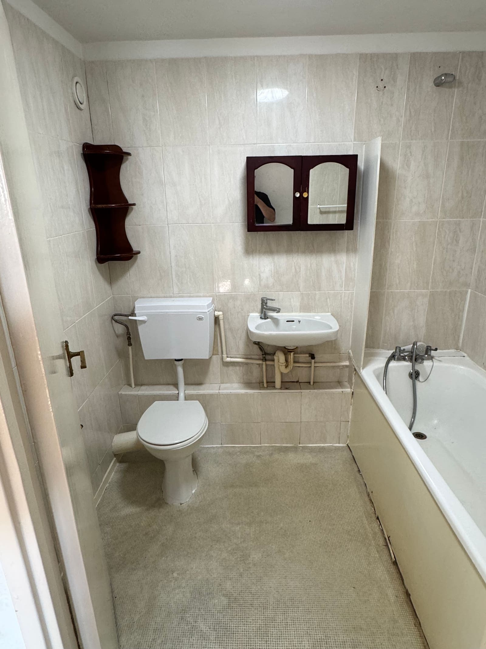 Dated bathroom with old suite and tiling before refurbishment, Osprey House Hove
